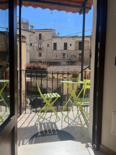 a view of a balcony with a table and chairs at Victor's House in Pacentro