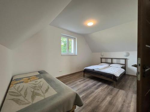 Postel nebo postele na pokoji v ubytování Holiday Home Počúvadlo