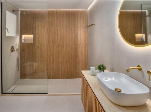 a bathroom with a sink and a shower at Divel Luxury Villas with heated pools, by Estia in Anissaras