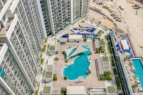 an aerial view of a pool in the middle of a building at GlobalStay The Crest Tower C Apartments Dubai in Dubai