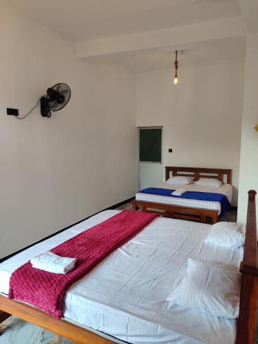 Postel nebo postele na pokoji v ubytování Sun Star Guest House