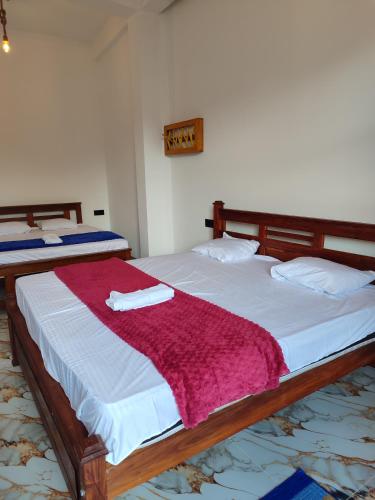 Postel nebo postele na pokoji v ubytování Sun Star Guest House