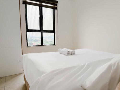 Кровать или кровати в номере Aston Acacia Luxe Retreat 7-8Pax with Free Netflix