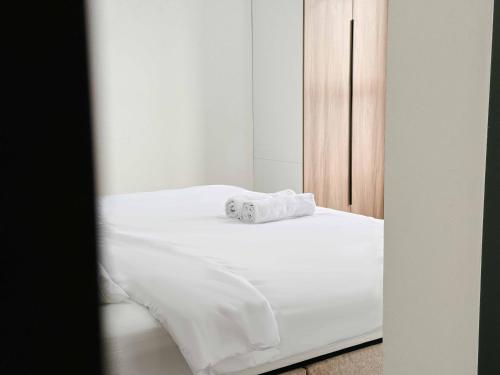 Кровать или кровати в номере Aston Acacia Luxe Retreat 7-8Pax with Free Netflix