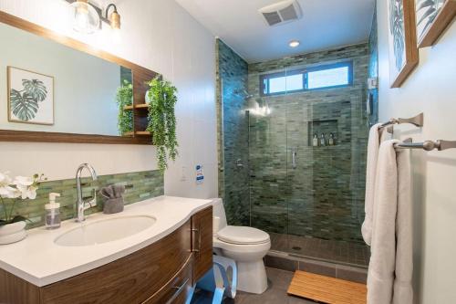 a bathroom with a sink and a shower at Luxury Hilltop Retreat in the City - Amazing View in San Diego