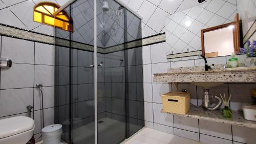 a bathroom with a shower and a toilet at Casa Térrea em Correntina in Correntina