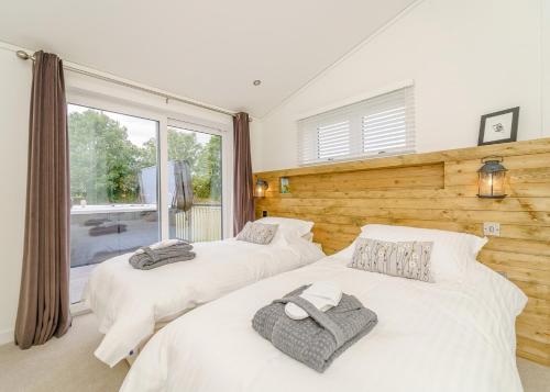 Ένα ή περισσότερα κρεβάτια σε δωμάτιο στο Winston Farm Lodges