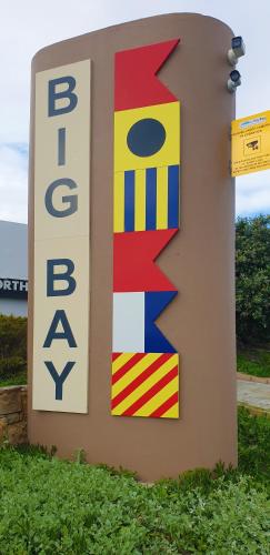 a sign for the british bus stop at Seaside Riviera in Cape Town