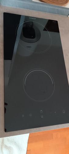 a laptop computer sitting on top of a table at Appartamento in Garbagnate Milanese