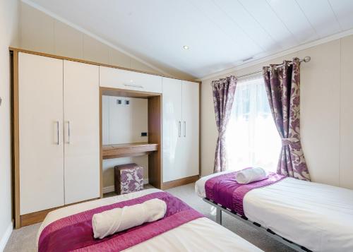 Katil atau katil-katil dalam bilik di Calthwaite Hall Lodges