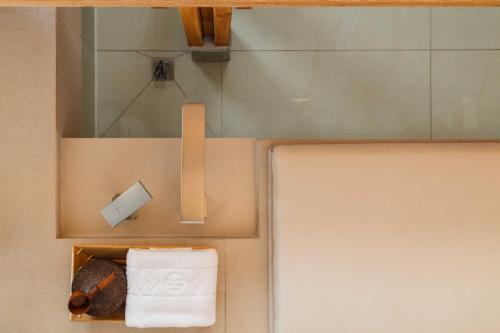 a box with toilet paper and a holder with towels at Luxury Hanok Stay Nuri in Seoul