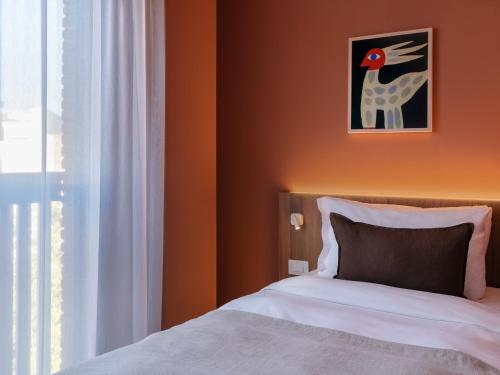 Postel nebo postele na pokoji v ubytování Numa Rome Trastevere