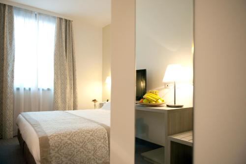 DB Hotel Verona Airport Congress & Spaにあるベッド