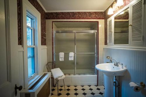 a bathroom with a sink and a shower at Twin Oaks Near Lake Wallenpaupack Historic Home in Hawley