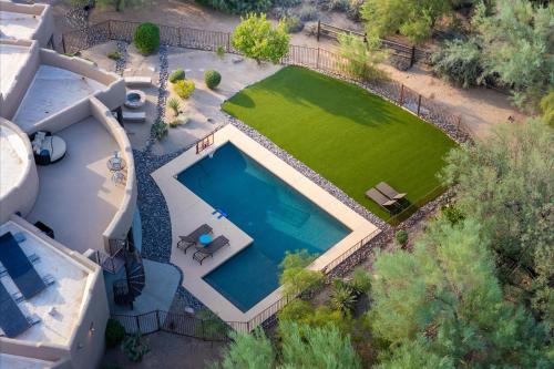 an aerial view of a house with a swimming pool at Mountain Views - Pool - Games - YogaDeck in Carefree