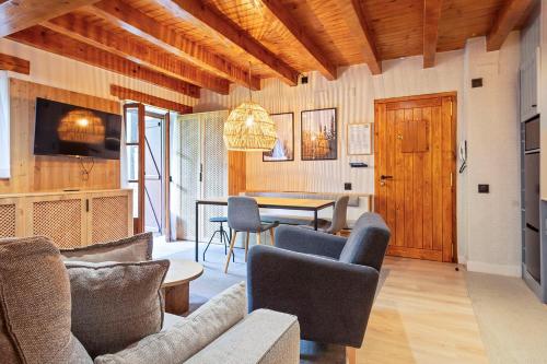 TV a/nebo společenská místnost v ubytování Luderna - Apartamento con jardín Pleta de Arties Montardo
