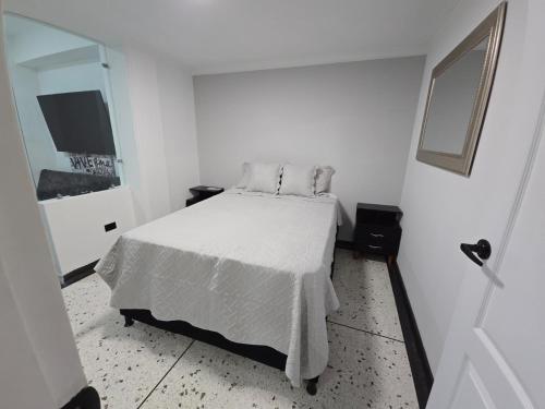 Ένα ή περισσότερα κρεβάτια σε δωμάτιο στο Hermoso Apartamento en el Centro de Armenia-Quindio