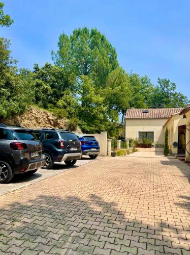 a group of cars parked in a parking lot at LES TERRASSES DE VALERIAN in Brignoles