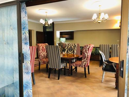a dining room with a table and chairs at Grafiti Boutique Hotel in Bela-Bela