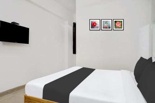 Hotel O Arusai Innにあるテレビまたはエンターテインメントセンター