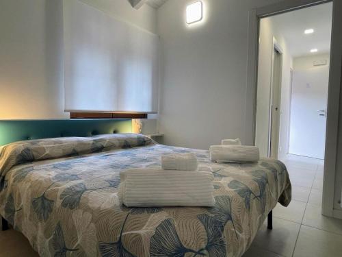 Postel nebo postele na pokoji v ubytování CASE VACANZE 24 - Somma Lombardo