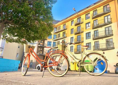 two bikes are parked in front of a building at The Cliffs - Sunset Village Beach 3C in Viveiro