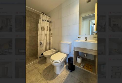a bathroom with a toilet and a sink at Rent a Flat Nueva Cordoba in Cordoba