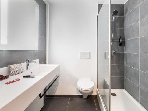 a bathroom with a sink and a toilet and a shower at ibis Strasbourg Centre Gare in Strasbourg