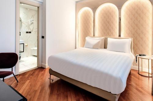 Ένα ή περισσότερα κρεβάτια σε δωμάτιο στο B&B Hotel Firenze Laurus Al Duomo