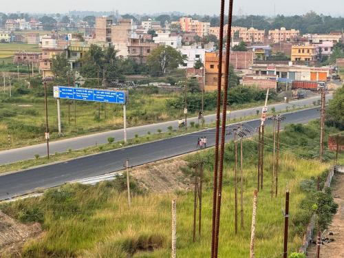 a street sign on the side of a highway at Hotel Nalanda City in Nalanda