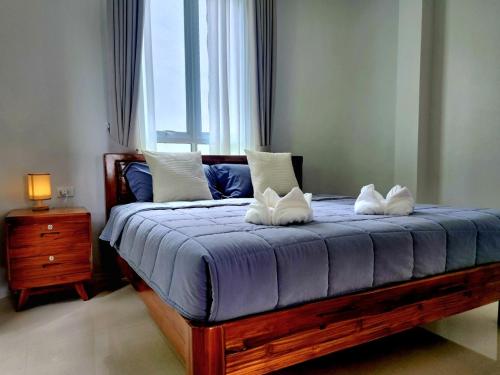 Giường trong phòng chung tại Phing Villa