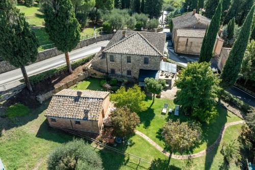an aerial view of an old house with trees at Maria Gabriella Holiday Home In Monticchiello in Monticchiello