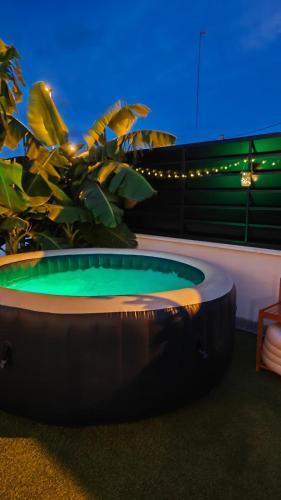 a large circular pool in front of a plant at Villa romántica en Murcia con jacuzzi privado in Los López