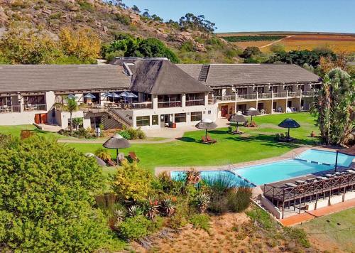 an aerial view of a house with a swimming pool at Piekenierskloof Mountain Resort by Dream Resorts in Citrusdal
