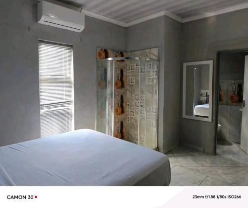 Letto o letti in una camera di Aroundcorner Guesthouse