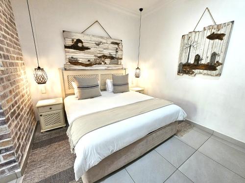 Ένα ή περισσότερα κρεβάτια σε δωμάτιο στο Leopard Tree Lodge