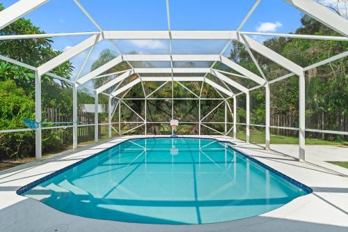 an overhead view of a swimming pool with a metal structure at Stuart Ranch Private Getaway in Stuart