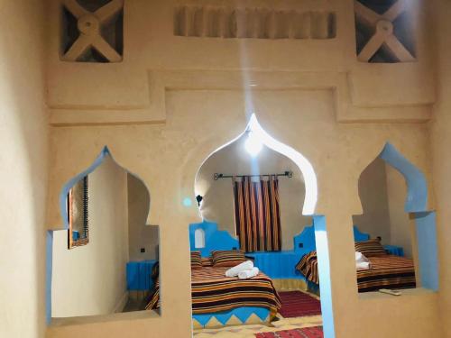Touareg Hotel Merzougaにあるベッド