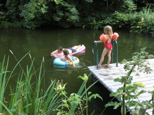 a group of people in the water on a dock at Familienbauernhof Gunzer-Sank in Eberstein