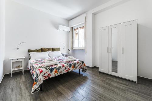 Postel nebo postele na pokoji v ubytování Fuori Ortigia room 1