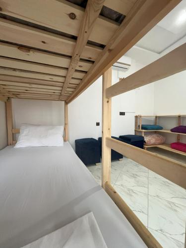 a bedroom with a bed and a bunk room at Sweet Taghazout Studios in Taghazout