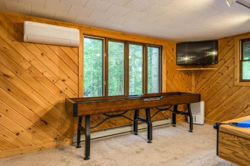 a room with a wooden wall with a desk at Lake Harmony Getaway in Lake Harmony