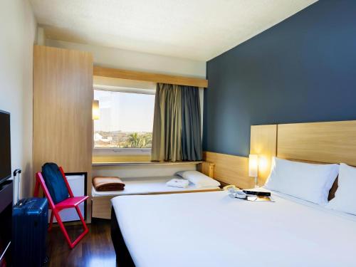 Cama o camas de una habitación en ibis Paulinia