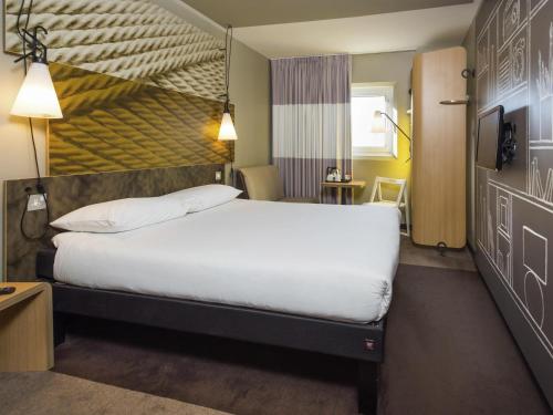 Ένα ή περισσότερα κρεβάτια σε δωμάτιο στο ibis Leicester
