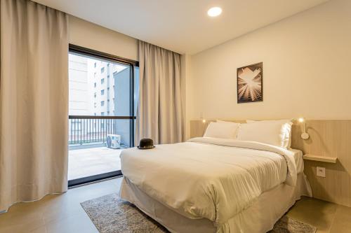 Cama o camas de una habitación en Charlie Sabiá Moema