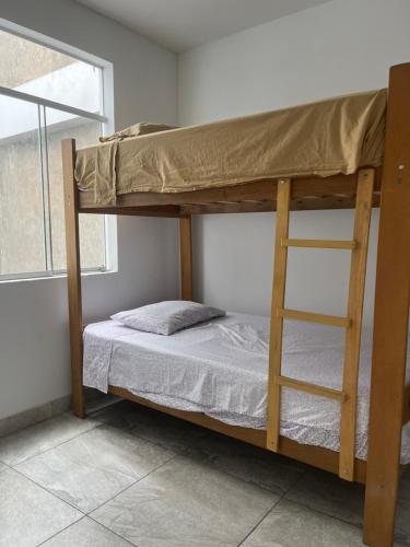 En eller flere senge i et værelse på Departamento único con vista al mar y terraza