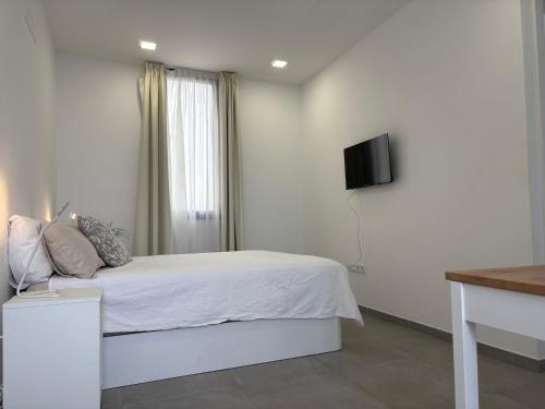 TV a/nebo společenská místnost v ubytování playa honda airport suite