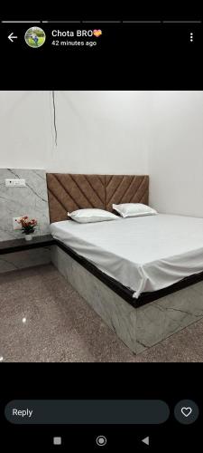 a picture of a bed in a room at Goverdhan seva sadan in Govardhan
