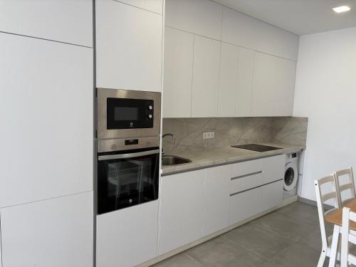 Kuchyň nebo kuchyňský kout v ubytování playa honda airport suite