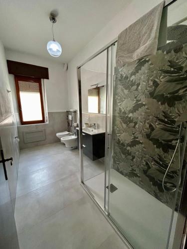 a bathroom with a shower and a sink at Da zio Emilio in Cardedu
